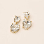 Crystal heart dangle earrings with stacked faceted clear stones and gold-tone settings