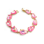 Teardrop crystal linked chain bracelet with bright pink stones and gold-tone setting