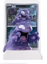 Pokémon Ivysaur figure in sealed bag, purple character with open mouth