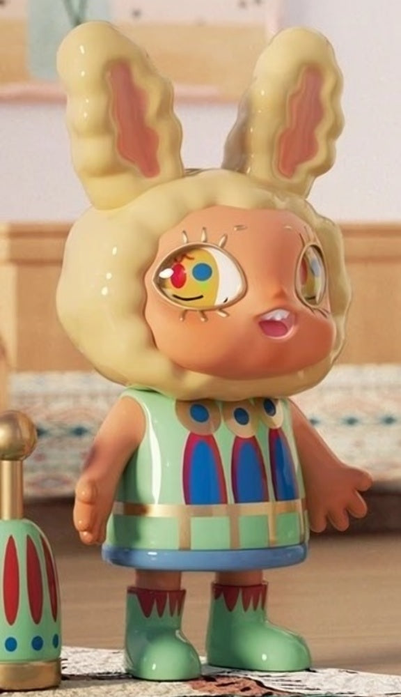 Yellow bunny-themed vinyl blind box figure with orange face, multicolor outfit, green boots