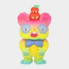 Colorful bunny-eared collectible figure with orange headpiece, blue bow tie, glowing suit