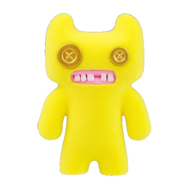 Yellow plush alien figure with round eyes, red-pink teeth, and gold buttons