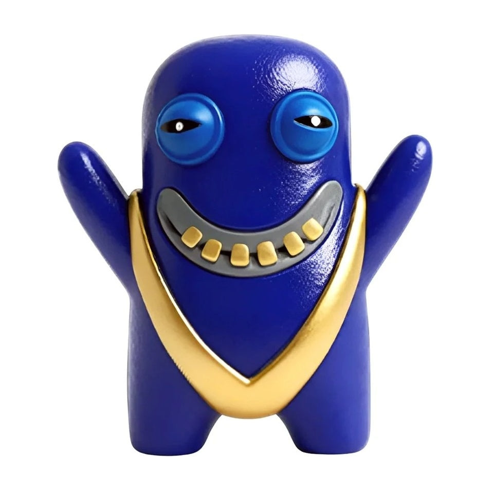 Blue collectible toy figure with gold grin and open-mouthed monster face