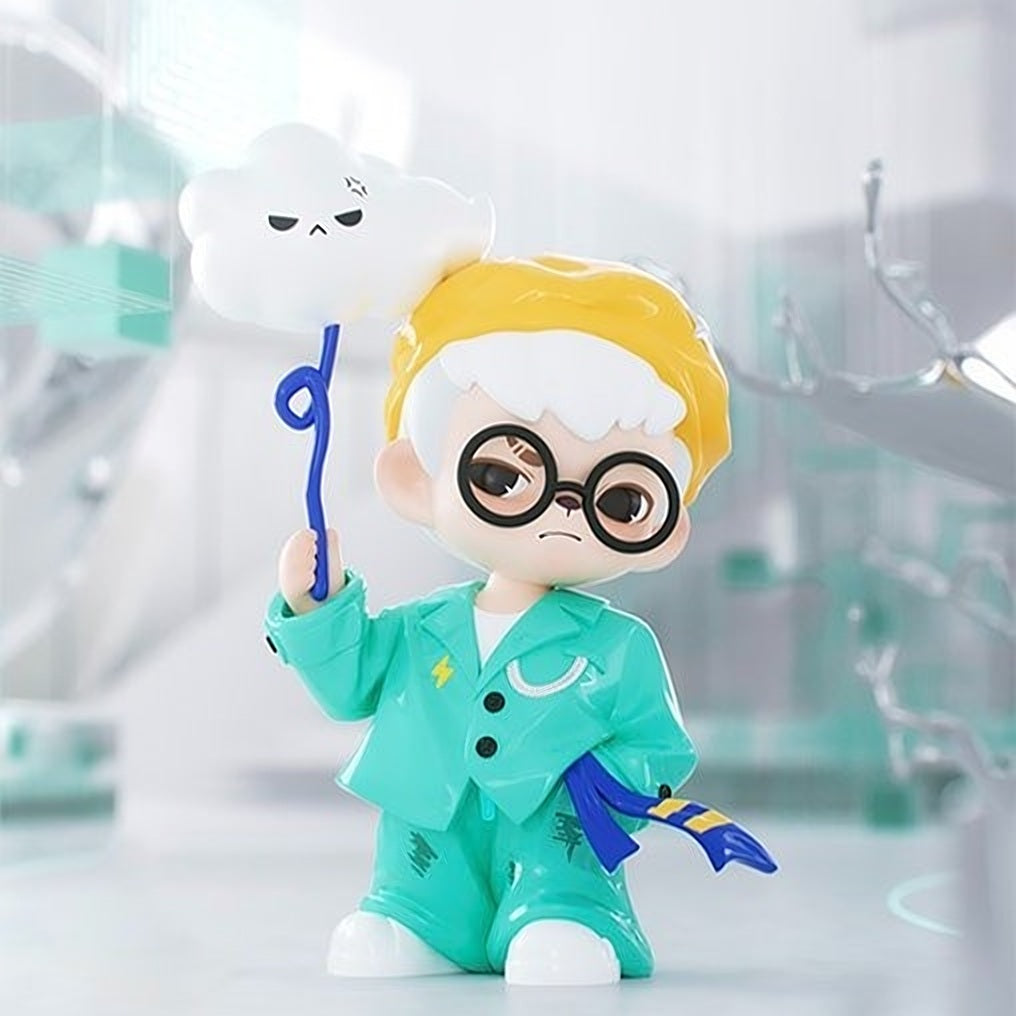 Blind box action figure of a chibi boy in teal coat, holding a blue wand