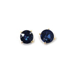 Round dark blue glass stud earrings with sterling silver posts and gold-tone settings