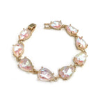 Teardrop crystal link bracelet with gold-tone settings and light pink glass stones.
