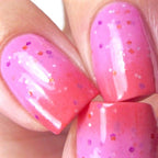 Thermal color-changing nail polish swatches, vivid pink nails with tiny multicolor speckles