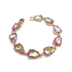 Teardrop crystal link bracelet with gold-tone settings and purple-pink iridescent stones.