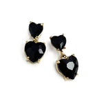 Gold-tone double heart dangle earrings with black faceted crystal hearts