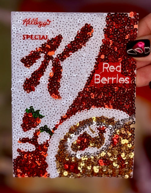 White sequin iron-on patch with red 'Red Berries' label and large '74' number