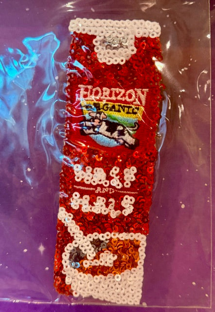 Red and white sequin iron-on patch shaped like bottle with Horizon granola text