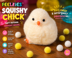 Fuzzy white plush chick sensory squeeze toy with orange beak and feet detail