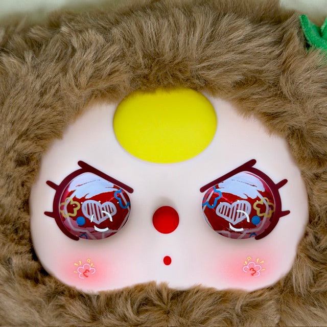 Plush kids backpack front face with yellow eye and red patterned eye details