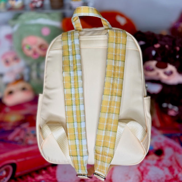 Kids backpack back view with cream body and yellow plaid adjustable straps
