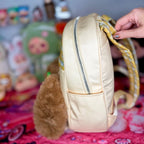 Cream kids backpack back view with zipper pocket and plaid handle detail