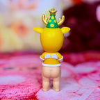 Sonny Angel yellow reindeer figure with green tree hat and white collar