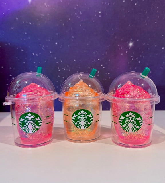 Glitter squishy stress cup toy, translucent pink and orange with Starbucks logo
