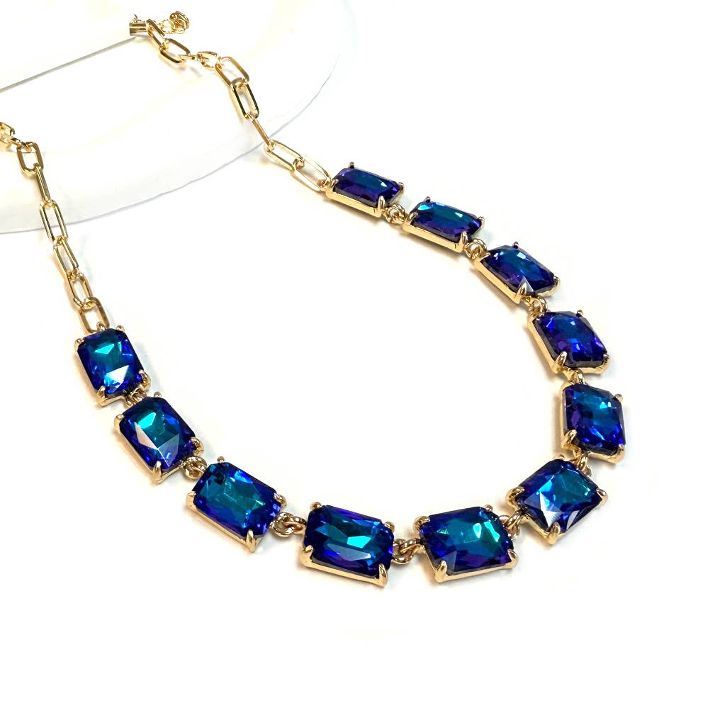 Gold-tone chain necklace with rectangular crystal links in blue AB color