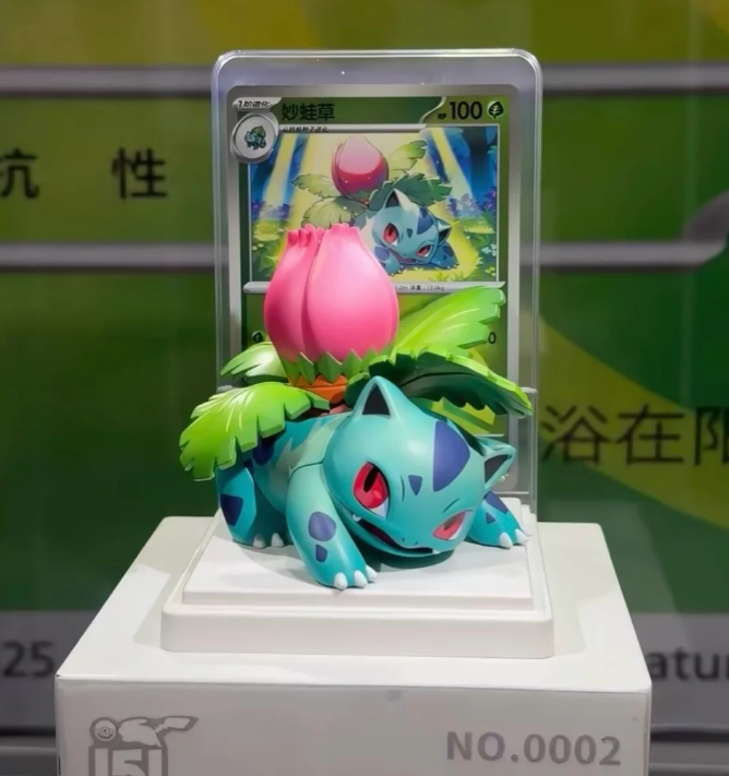 Ivysaur figure with pink bulb on display stand
