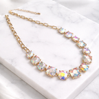 Gold-tone iridescent crystal necklace with multi-color cushion-cut square stones