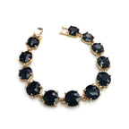 Dark round-cut crystal linked bracelet with black stones and gold-tone settings