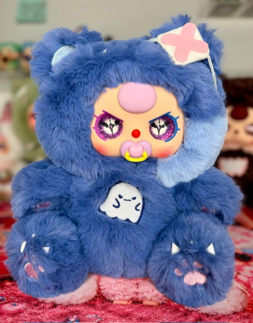Blue plush bear with star accessory and ghost emblem on chest, three-face design