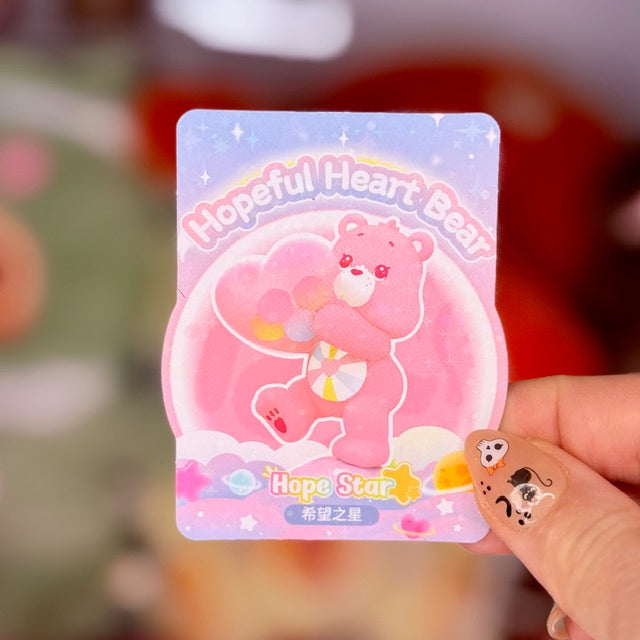 Hope Star Bear collectible figure card featuring artwork of the pink bear and heart accessory