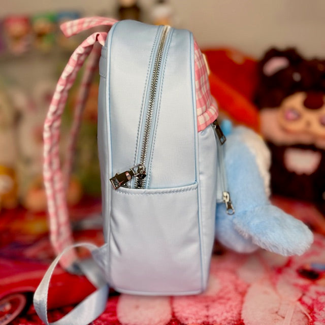 Light blue kids backpack side view with gingham strap and front zipper pocket