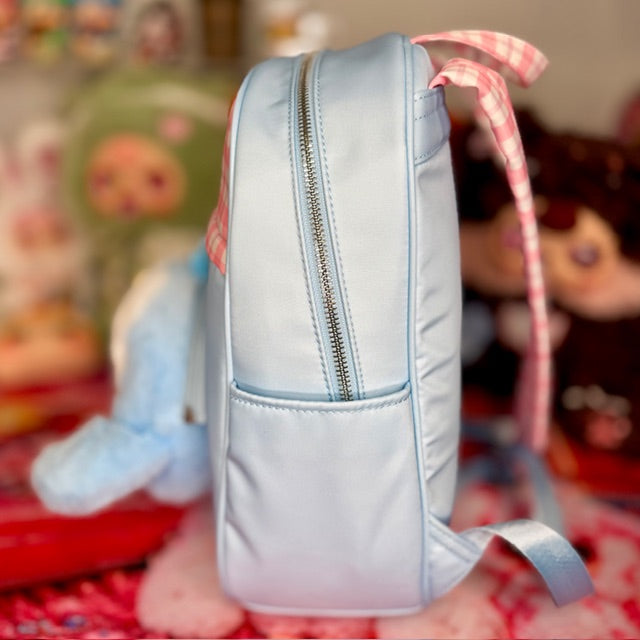 Light blue kids backpack with front zipper pocket and adjustable strap