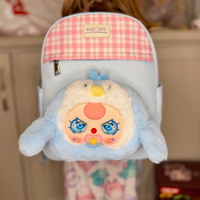 Kids light blue backpack with pink gingham top and plush character face pocket