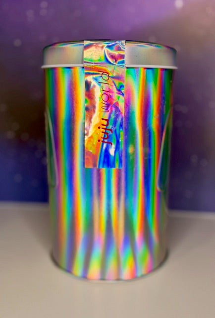 Holographic metal tin with ribbon slot and "Juju World" branding