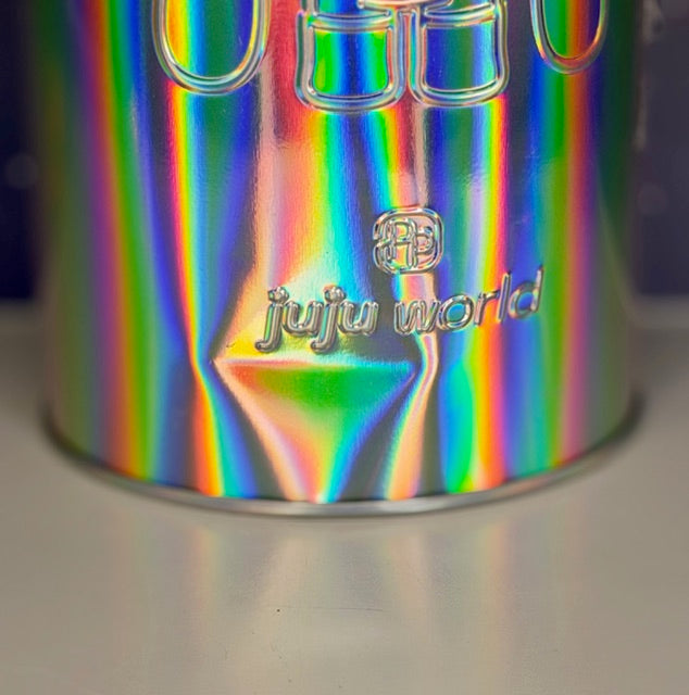 Holographic tin close-up with "Juju World" logo and central diamond charm