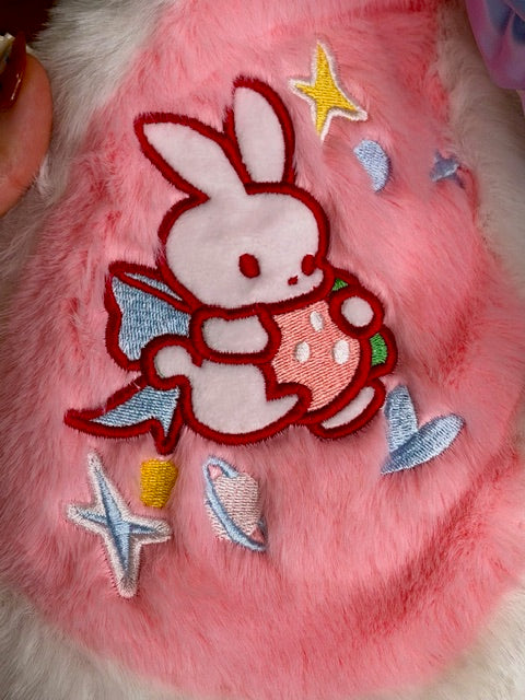 Pink plush hood panel with embroidered white bunny, ice-cream, stars, and hearts