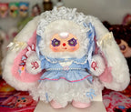Plush baby figure with blue layered dress, white lace bonnet, pearl belt, fluffy sleeves