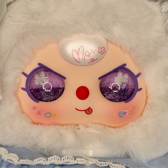 Plush baby figure head with orange face, purple glitter eyes, red nose, white hood