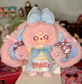 Pink and light blue plush figure in sailor-style dress with big bow and side arms