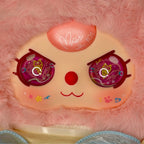 Pink plush figure face with smiling blush and glitter round eyes