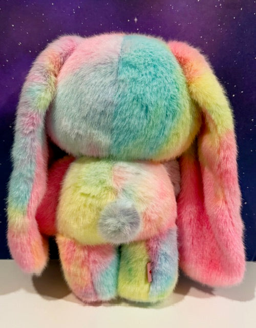 Pastel rainbow plush bunny with long floppy ears and striped body