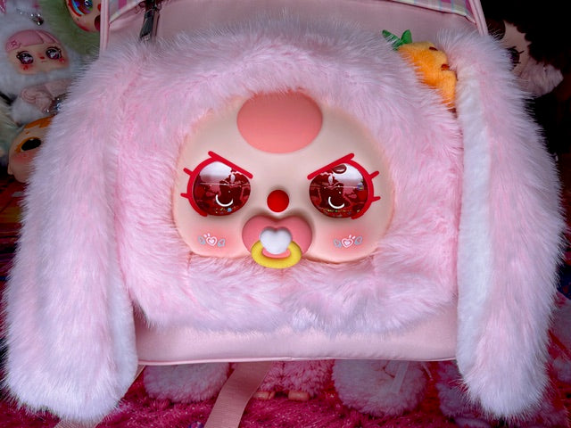 Pink plush bunny face backpack with embroidered eyes and heart nose patch