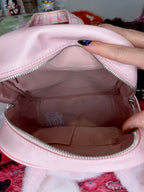 Pink kids backpack open top compartment with zipper and interior tags