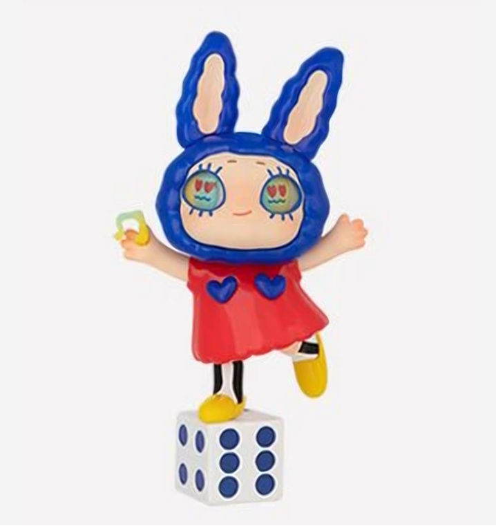 Rabbit-themed chibi figurine with blue hood, red dress, yellow shoes, on cube base