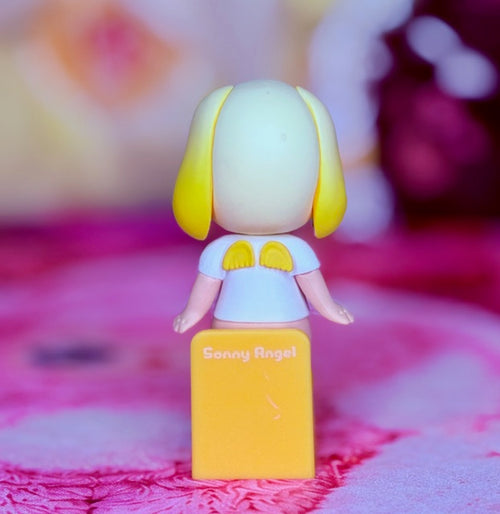 Lop-eared rabbit figurine in light blue top and yellow base