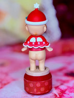Sonny Angel Christmas Santa figure with red hat and white trim, red outfit, on rotating base