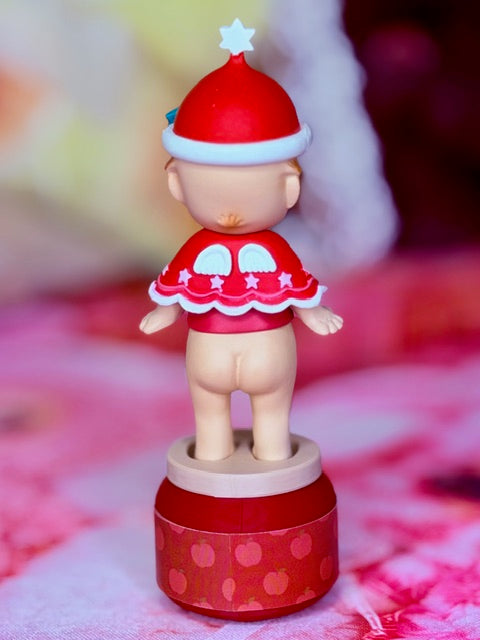 Sonny Angel Christmas Santa figure with red hat and white trim, red outfit, on rotating base