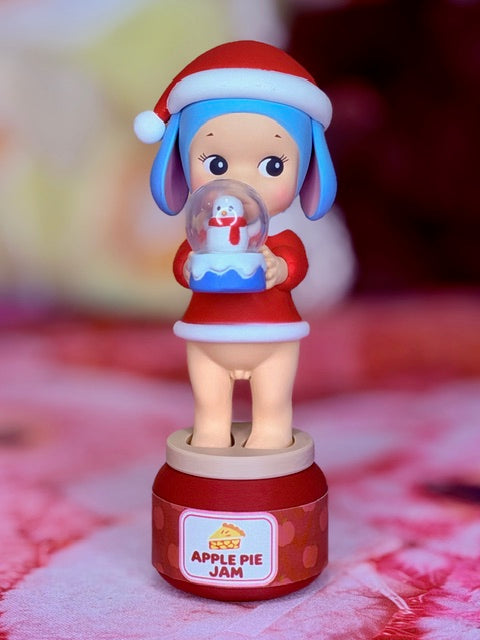 Sonny Angel Christmas mini figurine holding jar, red base with 'APPLE PIE JAM' label