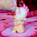 Cherry blossom collectible figurine, pale body with pink horn tufts and flower chest