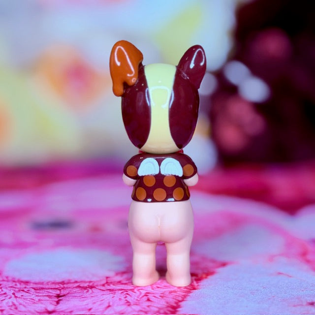 French bulldog vinyl figurine with maroon ears and heart-themed outfit