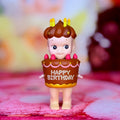 Sonny Angel birthday cake figurine with 'HAPPY BIRTHDAY' sign and lit candles