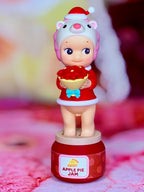 Pink character holding red apple pie jam on red label base