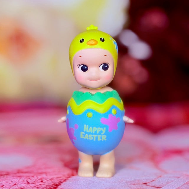 Easter collectible figure in purple hatching egg with green rim and 'Happy Easter' print